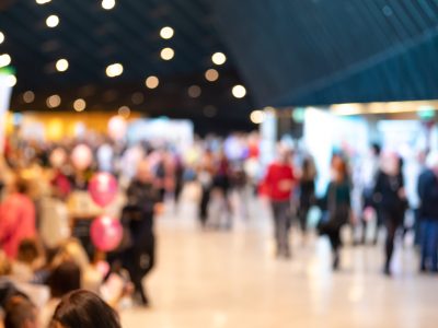 Blurred crowd of people in modern interior during event