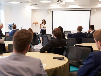 Businesswoman Making Presentation At Conference
